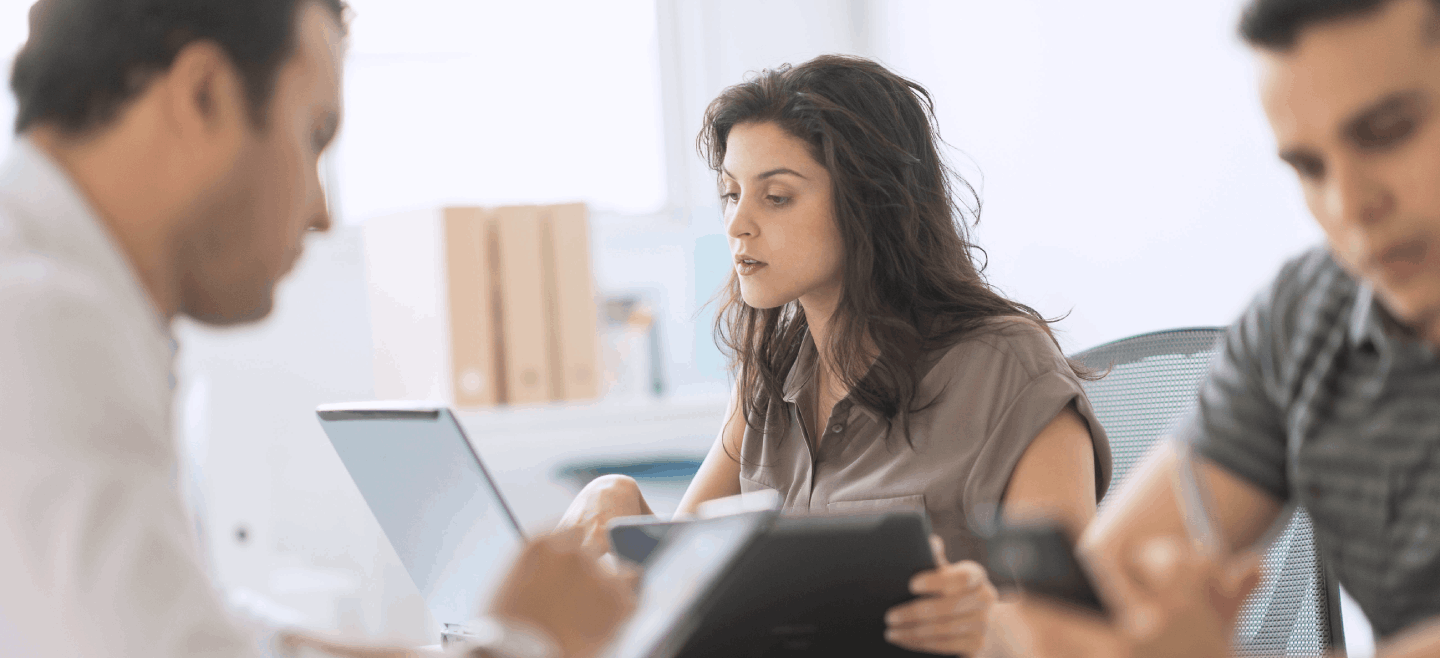 Women with pad and laptop